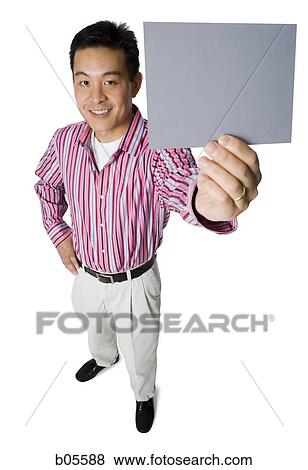 Man smiling with blank sign View Large Photo Image Stock Photo - Man smiling with blank sign. Fotosearch