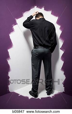 Man standing in the corner View Large Photo Image Stock Photo - Man standing in the corner. Fotosearch