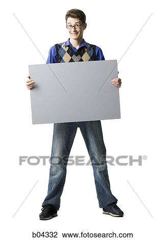 Man standing with blank sign View Large Photo Image Stock Image - Man standing with blank sign. Fotosearch