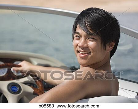 Man steering boat smiling View Large Photo Image Stock Image - Man steering boat smiling. Fotosearch