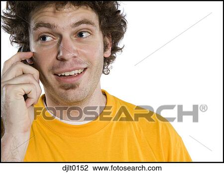 Stock Image - Man talking on cell phone. Fotosearch