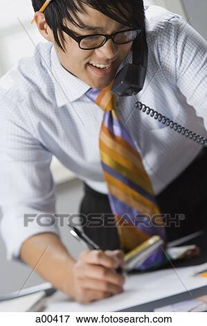 Man talking on phone View Large Photo Image Stock Photo - Man talking on phone. Fotosearch