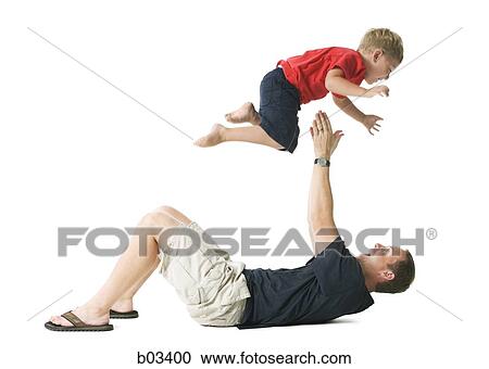 Man tossing boy in air View Large Photo Image Stock Image - Man tossing boy in air. Fotosearch
