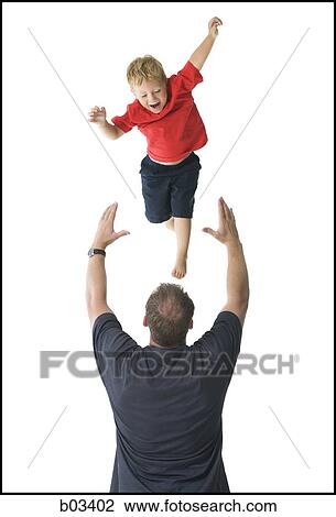 Man tossing boy in air View Large Photo Image Stock Image - Man tossing boy in air. Fotosearch