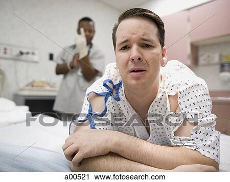 Man waiting anxiously for doctor exam View Large Photo Image Stock Image - Man waiting anxiously for doctor exam. Fotosearch