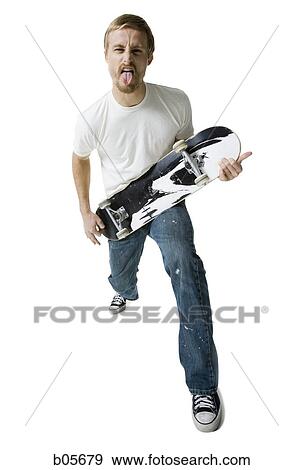 Man with a skateboard View Large Photo Image Stock Photo - Man with a skateboard. Fotosearch