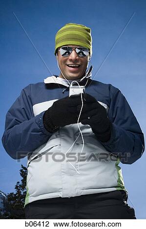 Man with an MP3 player View Large Photo Image Stock Image - Man with an MP3 player. Fotosearch