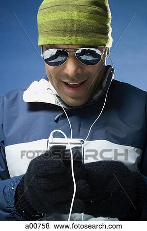 Stock Photo - Man with an MP3 player. Fotosearch