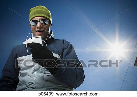 Stock Photo - Man with an MP3 player. Fotosearch