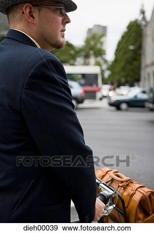 Man with bicycle and briefcase View Large Photo Image Stock Photo - Man with bicycle and briefcase. Fotosearch