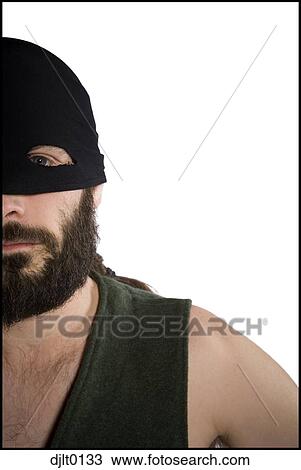 Stock Image - Man with black mask. Fotosearch
