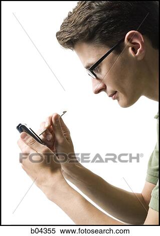 Stock Photography - Man with electronic organizer. Fotosearch