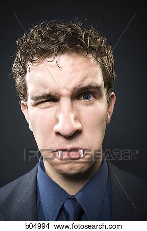 Man with fangs winking View Large Photo Image Picture - Man with fangs winking. Fotosearch