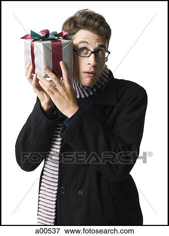 Stock Photo - Man with gift box. Fotosearch