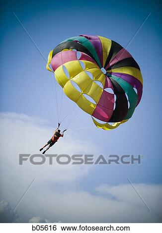 Man with parachute floating View Large Photo Image Stock Photograph - Man with parachute floating. Fotosearch