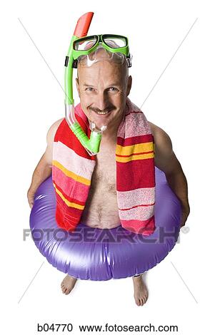 Man with swimming tube and snorkel smiling View Large Photo Image Stock Image - Man with swimming tube and snorkel smiling. Fotosearch