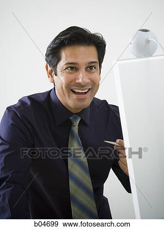 Man working at a computer View Large Photo Image Stock Photo - Man working at a computer. Fotosearch