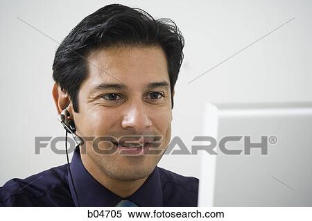 Man working at a computer View Large Photo Image Stock Photography - Man working at a computer. Fotosearch