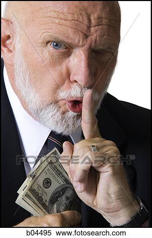Mature businessman hiding money View Large Photo Image Stock Photography - Mature businessman hiding money. Fotosearch