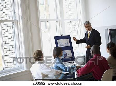 Mature businessman making presentation View Large Photo Image Stock Image - Mature businessman making presentation. Fotosearch
