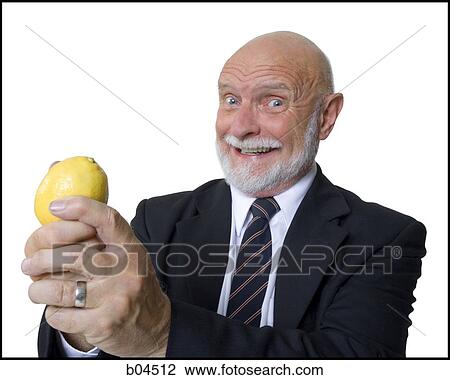 Mature businessman with lemon View Large Photo Image Stock Image - Mature businessman with lemon. Fotosearch