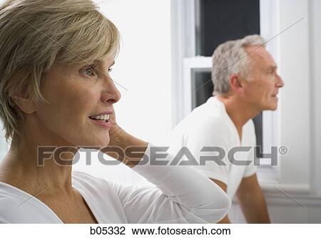 Mature couple in bathroom grooming View Large Photo Image Stock Image - Mature couple in bathroom grooming. Fotosearch