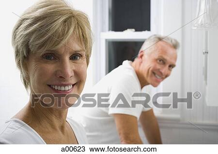 Mature couple in bathroom smiling View Large Photo Image Stock Image - Mature couple in bathroom smiling. Fotosearch