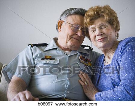 Mature couple sitting on the couch View Large Photo Image Stock Photo - Mature couple sitting on the couch. Fotosearch