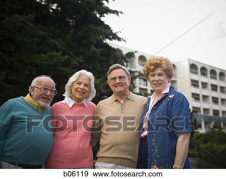 Stock Photo - Mature couples outside. Fotosearch