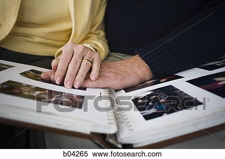 Mature hands on photo album View Large Photo Image Stock Photography - Mature hands on photo album. Fotosearch