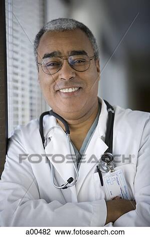Mature male doctor smiling View Large Photo Image Stock Image - Mature male doctor smiling. Fotosearch