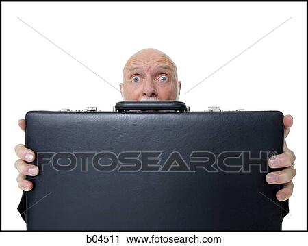 Mature man hiding behind briefcase View Large Photo Image Stock Image - Mature man hiding behind briefcase. Fotosearch