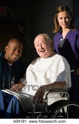 Mature man in wheelchair posing with doctor and nurse View Large Photo Image Stock Image - Mature man in wheelchair posing with doctor and nurse. Fotosearch