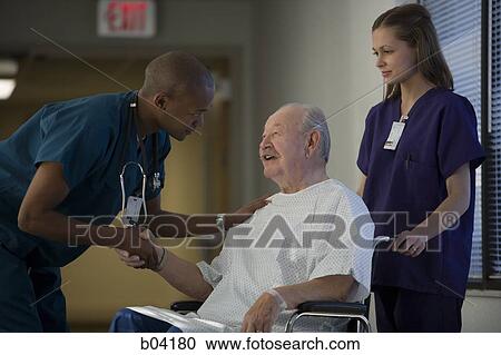 Mature man in wheelchair with doctor and nurse View Large Photo Image Stock Image - Mature man in wheelchair with doctor and nurse. Fotosearch