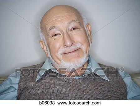 Mature man sitting on a couch View Large Photo Image Stock Photo - Mature man sitting on a couch. Fotosearch