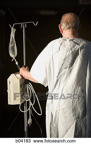 Mature man walking with IV Stand from behind View Large Photo Image Stock Image - Mature man walking with IV Stand from behind. Fotosearch