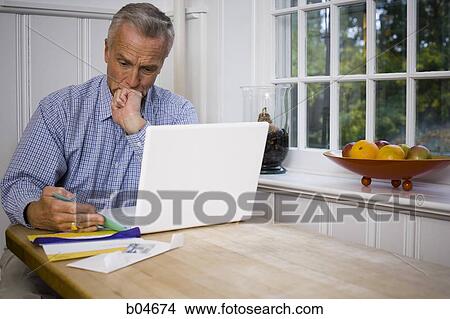 Mature man with laptop View Large Photo Image Picture - Mature man with laptop. Fotosearch