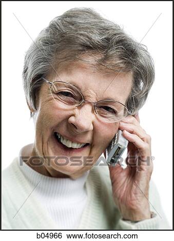 Mature woman talking on cellular phone View Large Photo Image Stock Photograph - Mature woman talking on cellular phone. Fotosearch