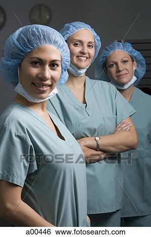 Stock Photograph - Medical personnel in operating room. Fotosearch