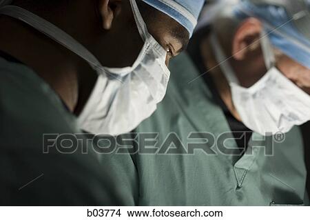 Medical personnel in surgery View Large Photo Image Picture - Medical personnel in surgery. Fotosearch