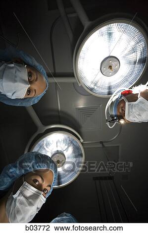 Medical personnel in surgery View Large Photo Image Stock Image - Medical personnel in surgery. Fotosearch