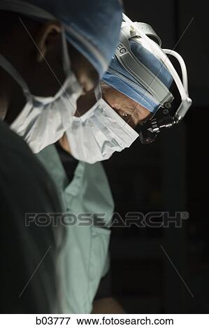 Medical personnel in surgery View Large Photo Image Stock Photo - Medical personnel in surgery. Fotosearch