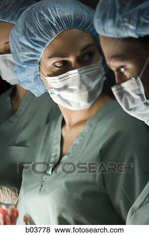 Medical personnel in surgery View Large Photo Image Stock Photo - Medical personnel in surgery. Fotosearch