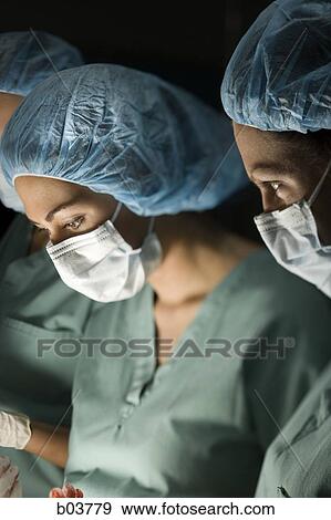Medical personnel in surgery View Large Photo Image Stock Photo - Medical personnel in surgery. Fotosearch