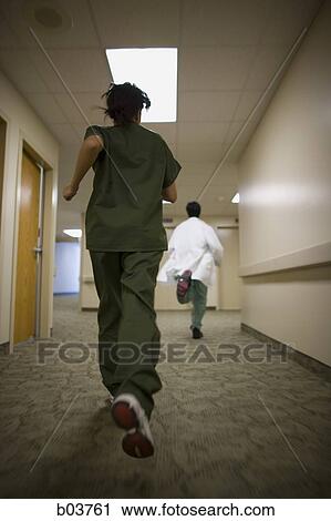 Stock Image - Medical personnel running. Fotosearch