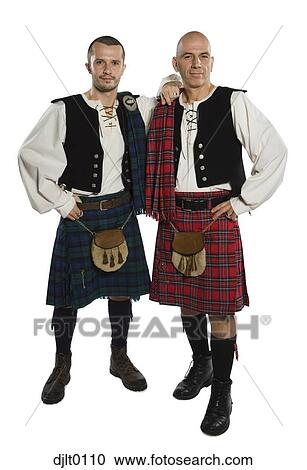 Stock Image - Men dressed in kilts. Fotosearch