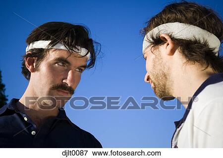 Stock Photo - Men with tennis headbands. Fotosearch