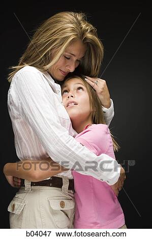 Mother and daughter hugging View Large Photo Image Stock Photo - Mother and daughter hugging. Fotosearch