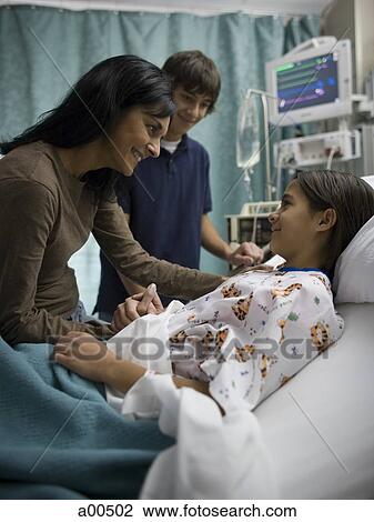 Mother and son talking to girl in hospital bed View Large Photo Image Stock Image - Mother and son talking to girl in hospital bed. Fotosearch