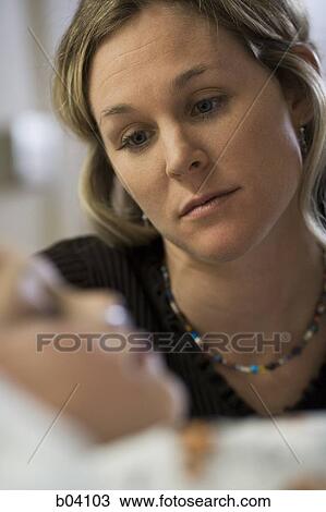 Mother looking at son in hospital bed View Large Photo Image Stock Image - Mother looking at son in hospital bed. Fotosearch